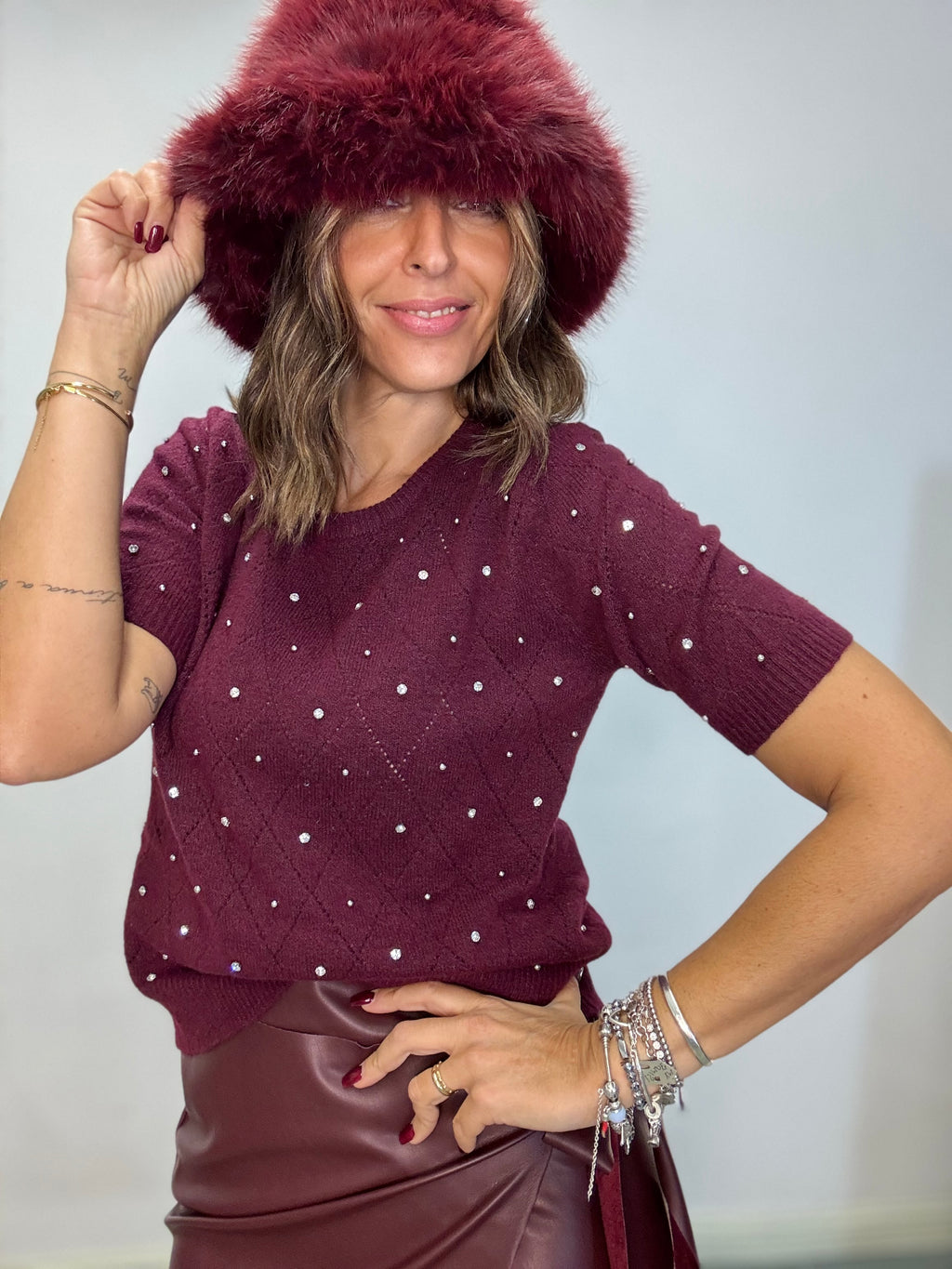 Il pull manca corta e perline