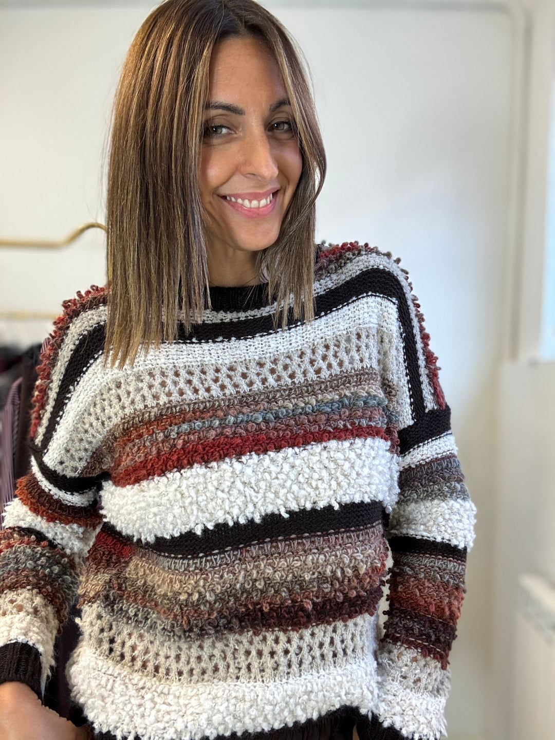 Il Pull bicolore boucle