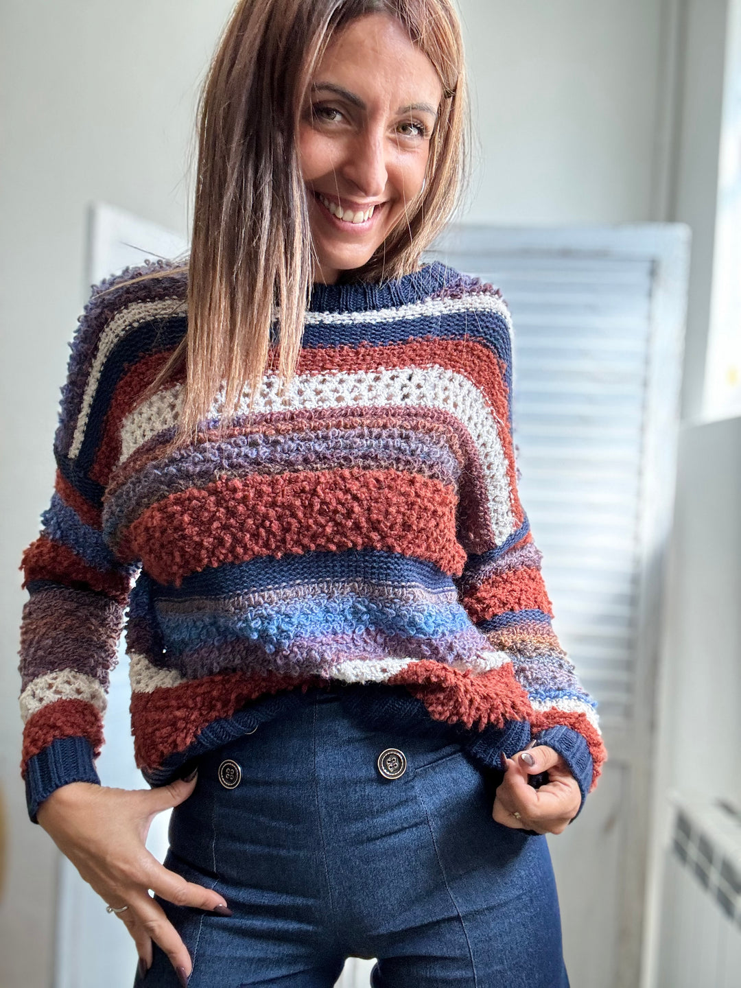Il Pull bicolore boucle