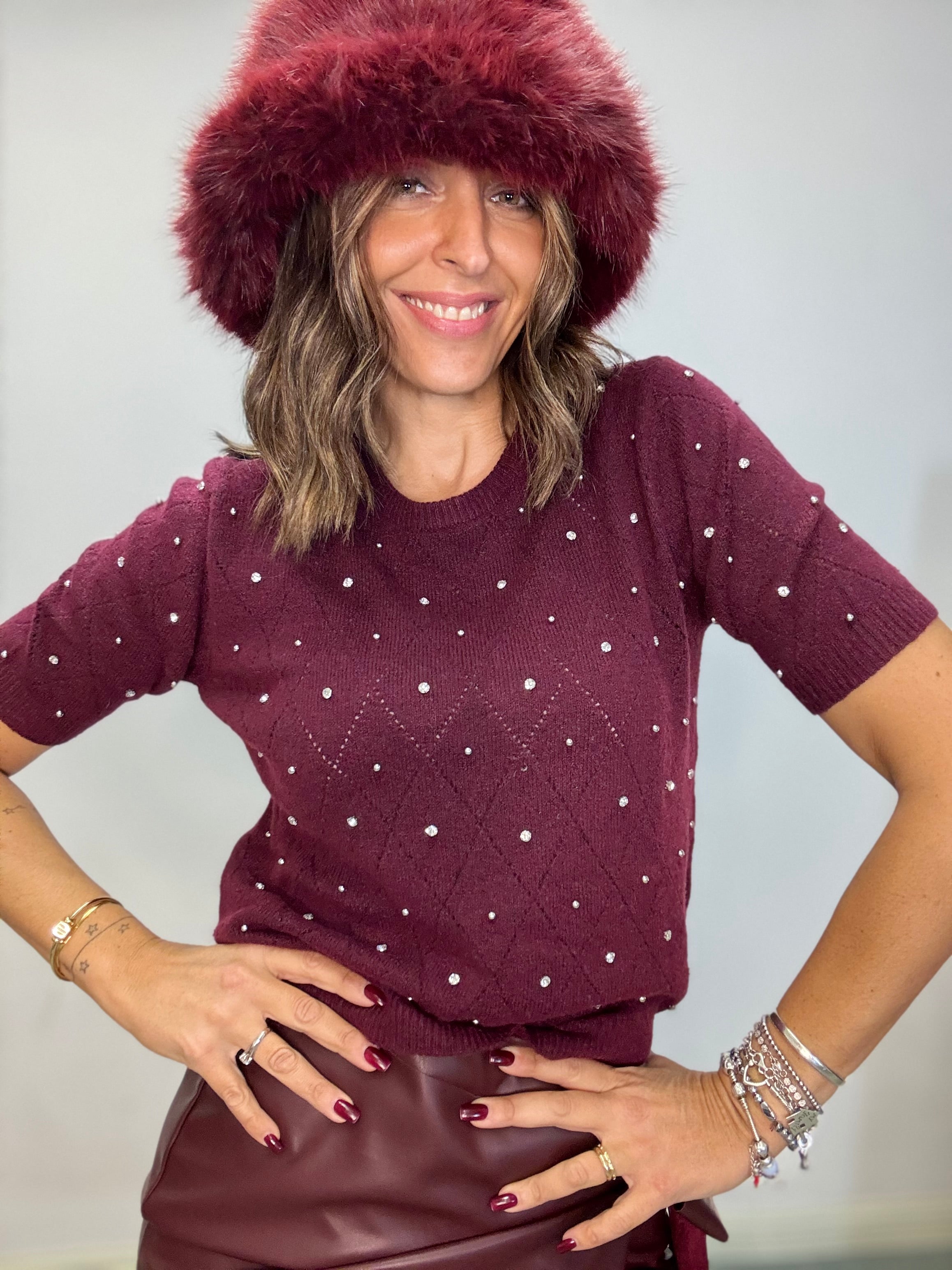 Il pull manca corta e perline