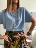 La blusa con la collana