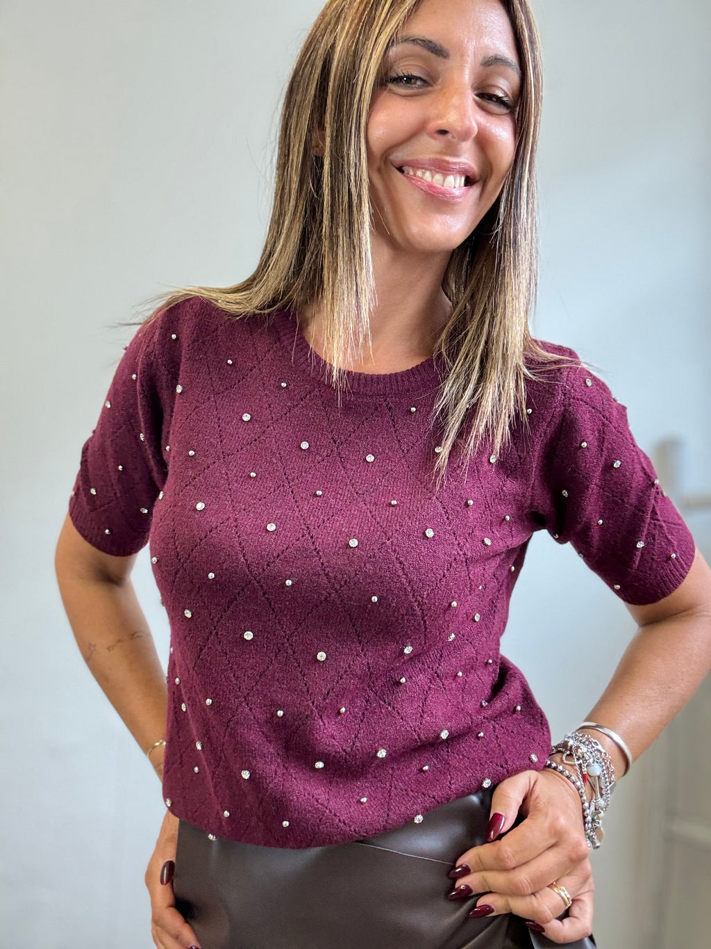 Il pull manca corta e perline