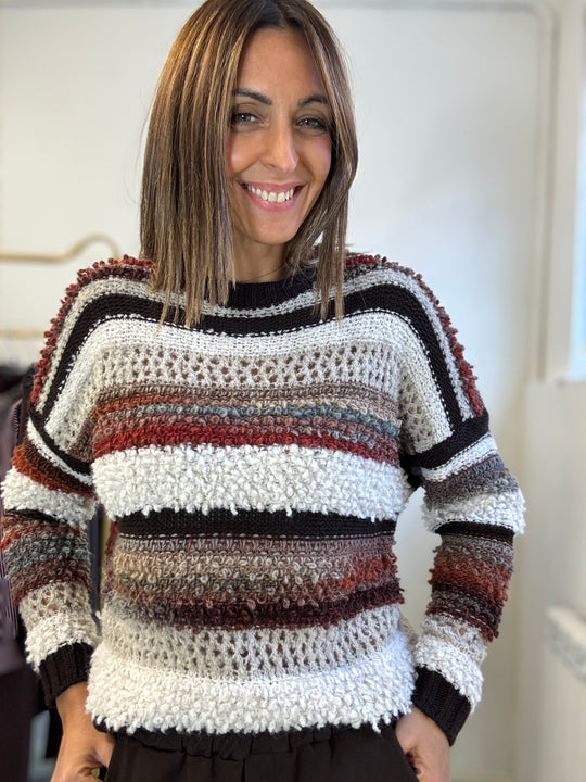 Il Pull bicolore boucle